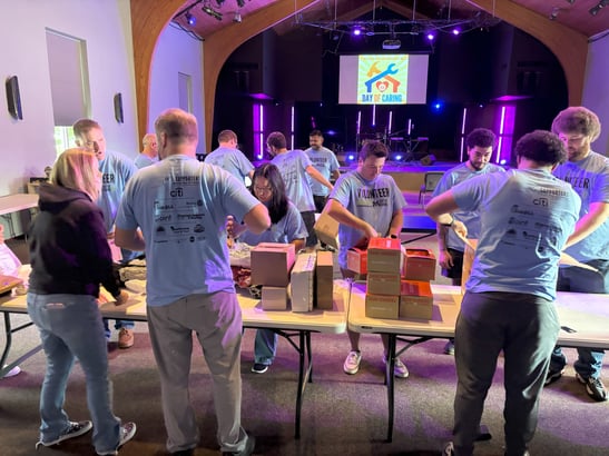 The team unboxes supplies for personal care kits