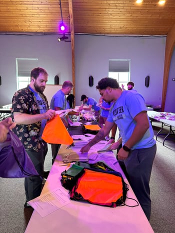 Members of the Innovative team assemble personal care kits